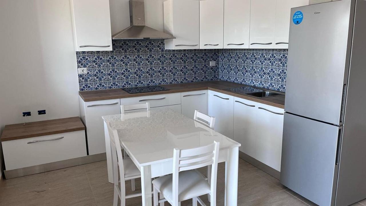 Residence Le Maree Porto Pino Bagian luar foto